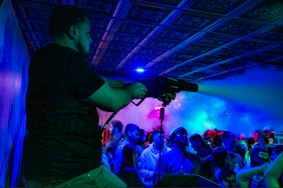 DJ Salvo with c02 gun at a club